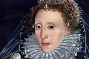 Elizabethan-era portrait of a noblewoman with a large lace ruff and jeweled headdress against a dark background.