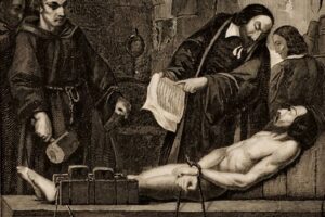 A group of robed figures perform an anatomical dissection on a bound, shirtless man lying on a table.
